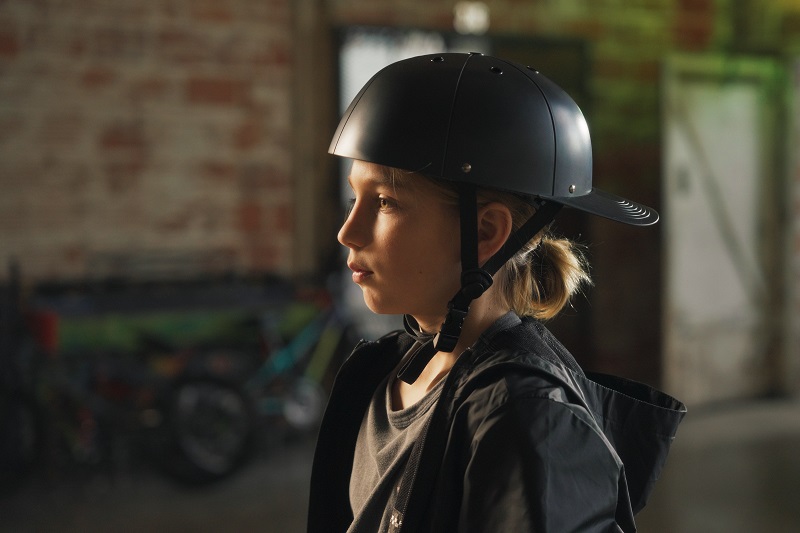 Indigenous Road Warriors ProLids Donation Close Up of a Young Girl Wearing a ProLids Helmet with the Bill on the Back