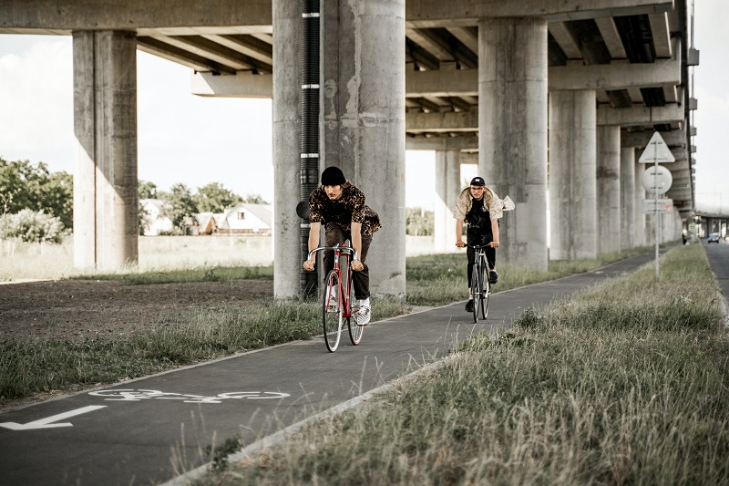 Top 5 States for Biking Trails Two People Riding Bikes on a Trail Under an Overpass