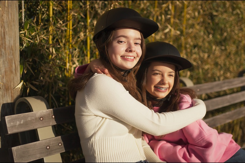 Why ProLids Helmets were Invented Two Young Girls Hugging While Wearing ProLids Helmets