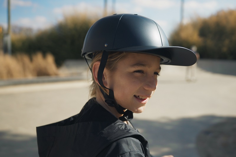 Why ProLids Helmets were Invented Close Up of a Young Girl Wearing a ProLids Helmet at a Skatepark