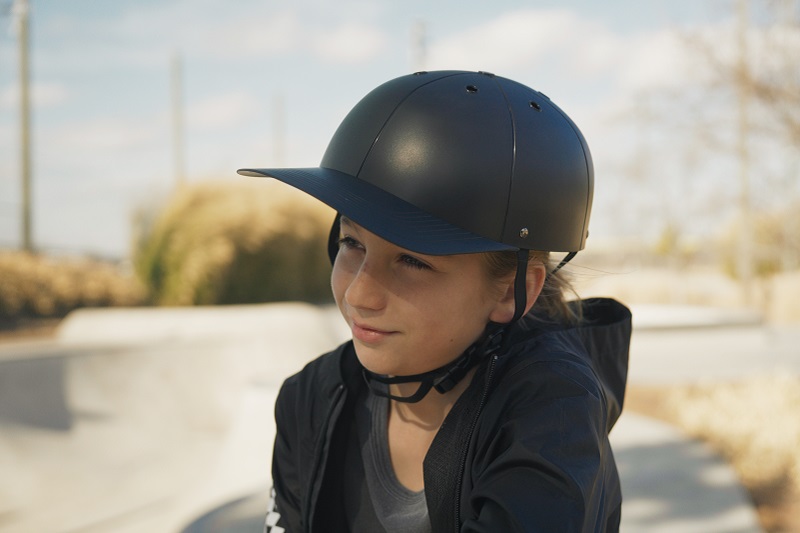 How to Adjust Helmets for a Better Fit Close Up of a Young Girl Wearing a ProLids helmet at a Skate Park