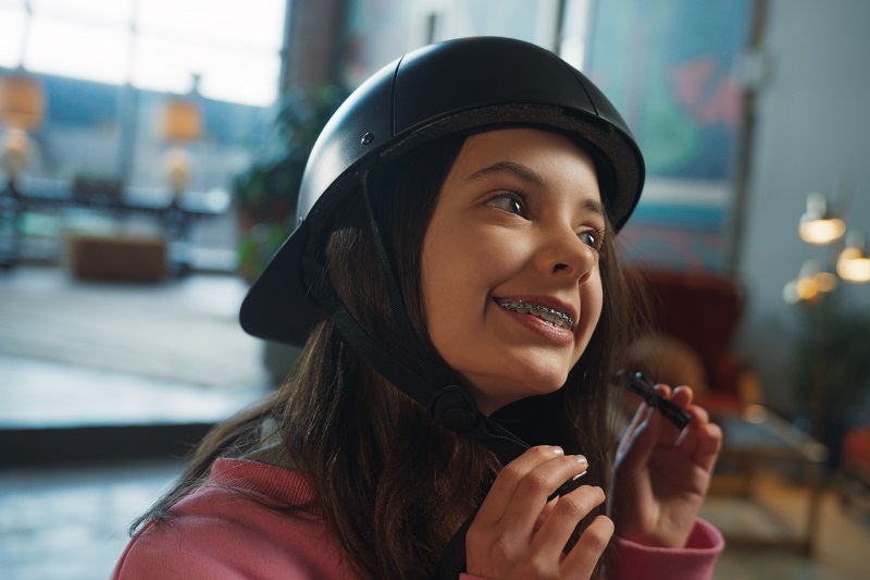 How to Personalize your ProLids Helmet a Little Girl Puttting on a ProLids Helmet