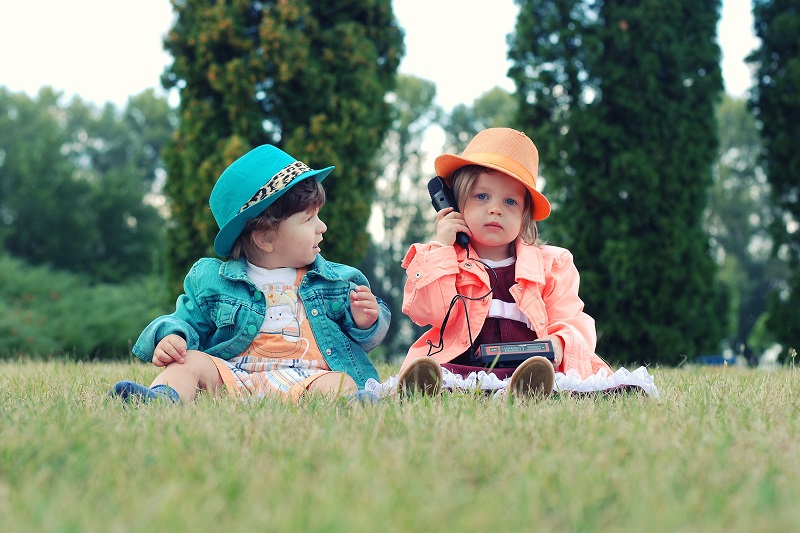 Balance Bike Tips for Toddlers Two Toddlers Dressed as Business People Working in a Pretend Office in a Field