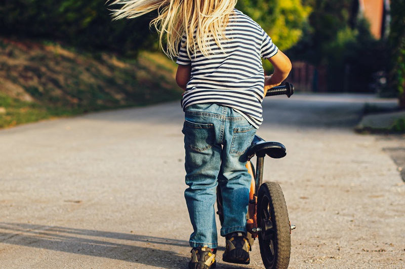 Balance Bike Tips for Toddlers a Toddler Walking with a Balance Bike