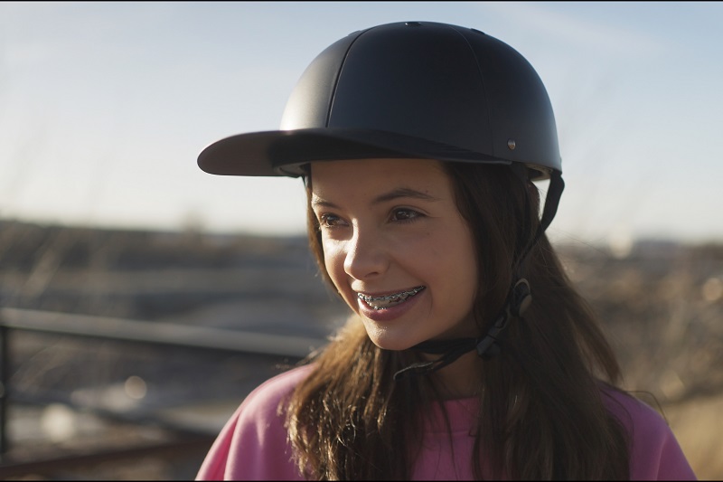 Helmet Strap Features Close Up of a Young Girl Wearing a ProLids Helmet