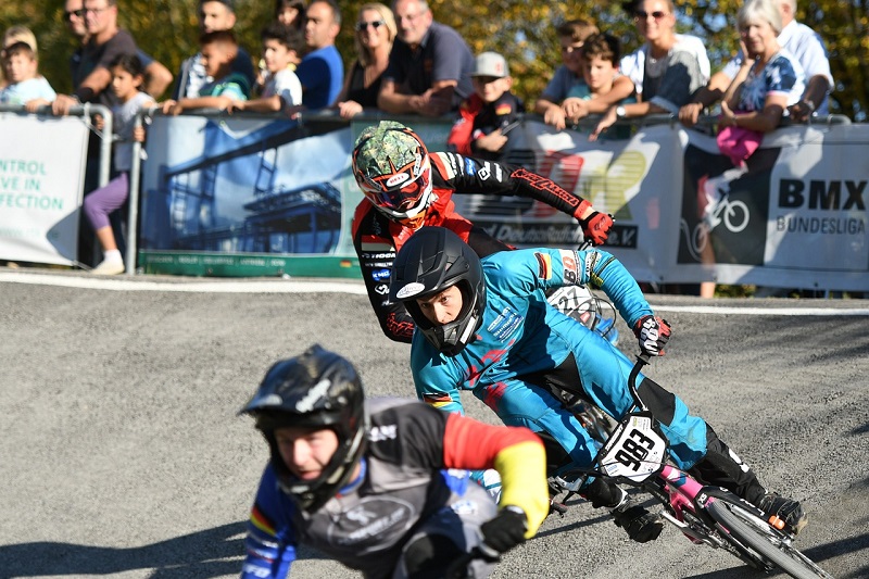Tips for Picking the Right BMX Bike BMX Racers Riding Around a Corner with an Audience in the Background