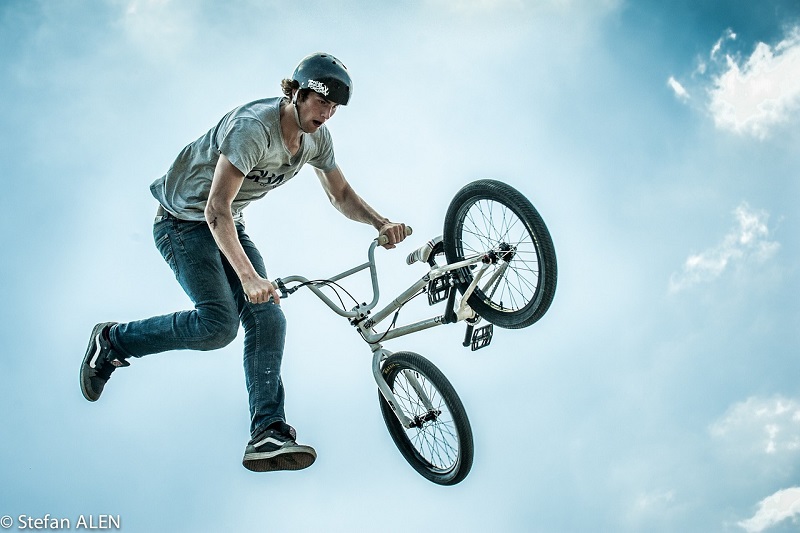 Tips for Picking the Right BMX Bike a BMX Pro Doing a Trick on a BMX Bike in the Air