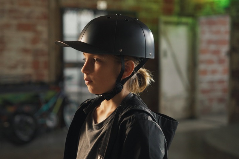 How to Know When to Replace Your Bike Helmet a Girl Wearing a ProLids Helmet In a Warehouse