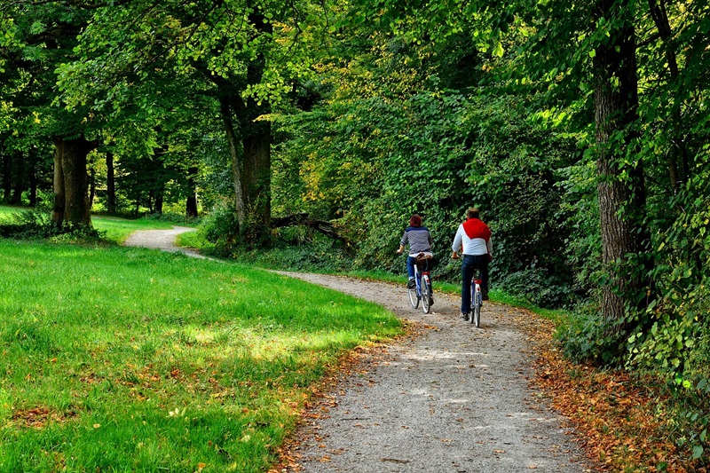 Best Minneapolis Bike Trails a Couple Riding Bikes on a Paved Trail Through a Park