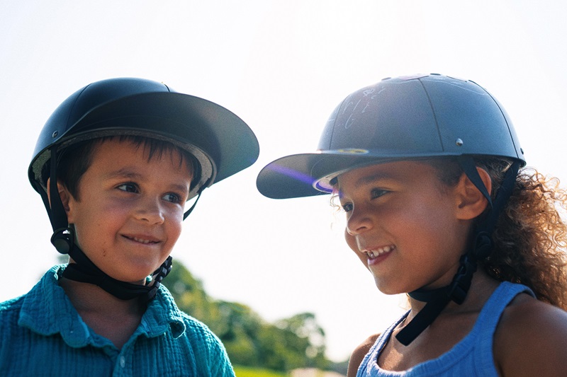 Types of Helmets for Kids Two Kids Standing Outside Wearing ProLids