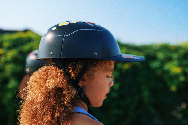 When to Replace a Helmet a Young Girl Wearing a Helmet Standing Outside