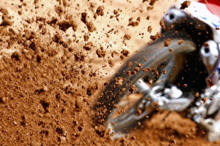 Tucson Dirt Biking Lessons Close Up of Dirt Flying Out from a Dirt Bike Tire