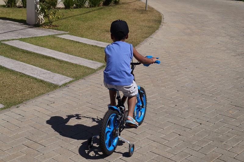 Best Bike Trails for Kids in Austin a Young Boy Riding a Blue Bike with Training Wheels