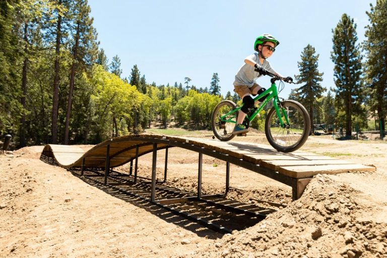 Best Bike Trails in Illinois a Kid Riding a Bike on a Wooden Ramp