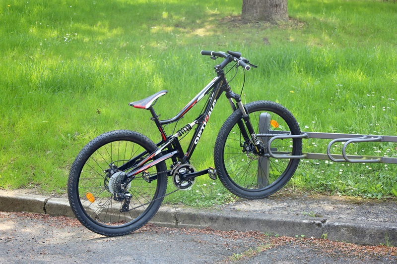 Best Bike Trails in Illinois a Bike in a Bike Rack Next to Grass